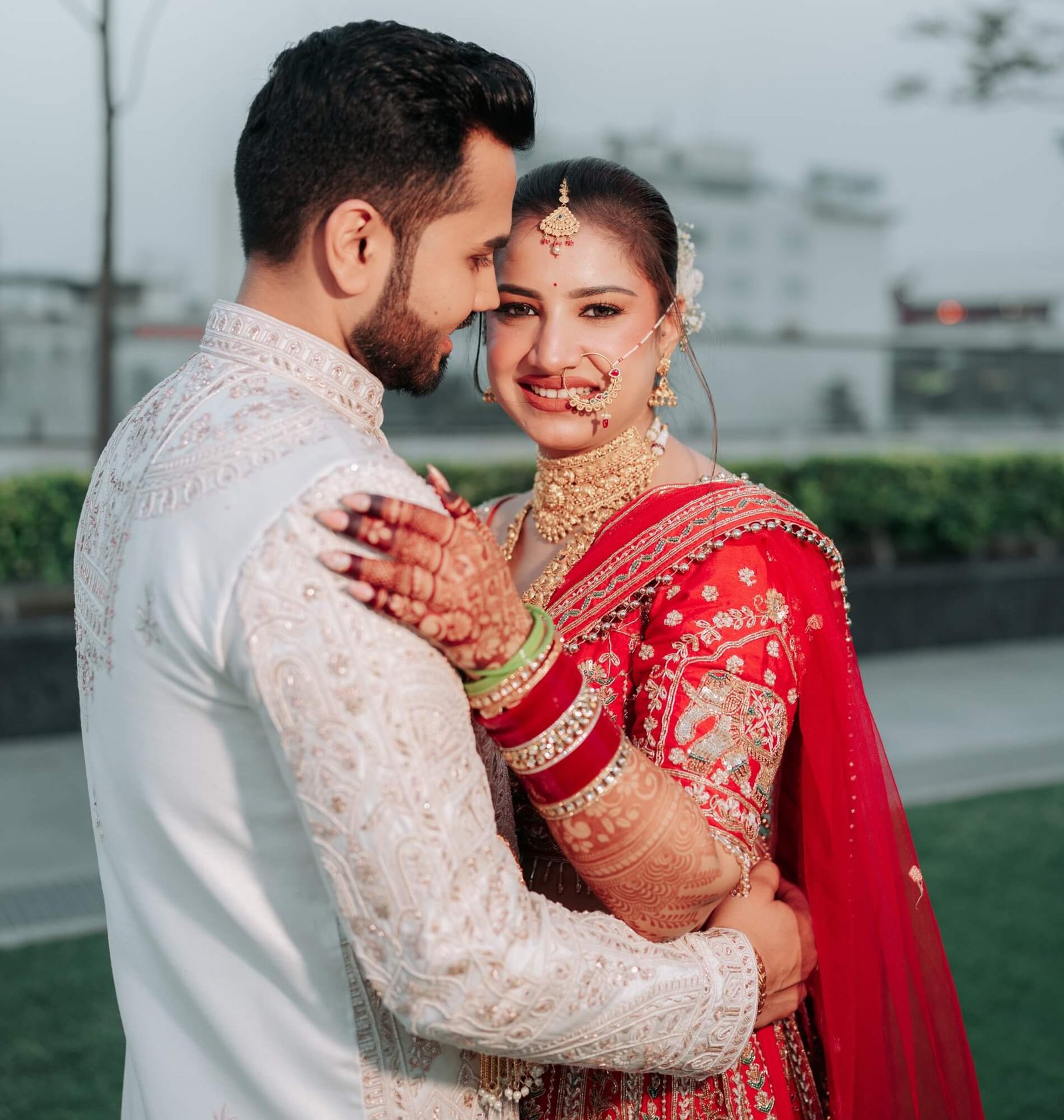 A candid moment of the couple sharing laughter, photographed by Mohey Rang Films—wedding photographers capturing genuine emotions and love stories.