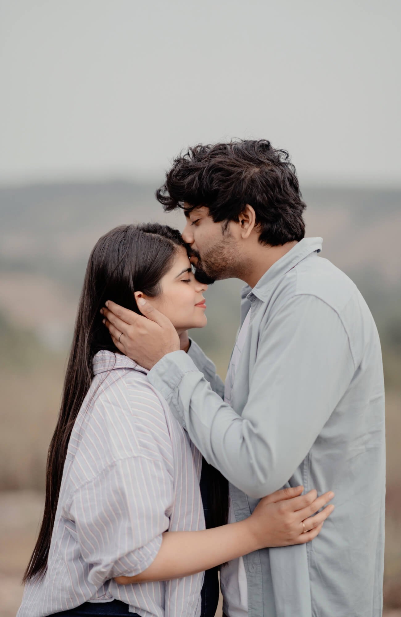 A candid pre-wedding moment of the couple laughing together, captured by Mohey Rang Films—expert wedding photographers capturing love naturally.
