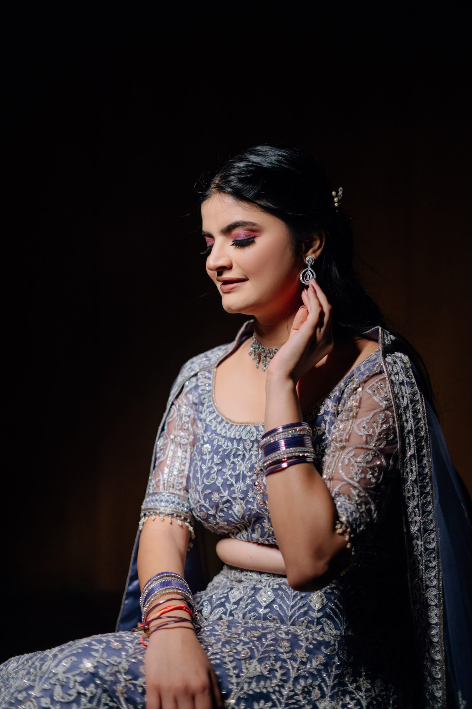 The groom preparing for his big day, captured in detailed and stylish wedding photographs by Mohey Rang Films