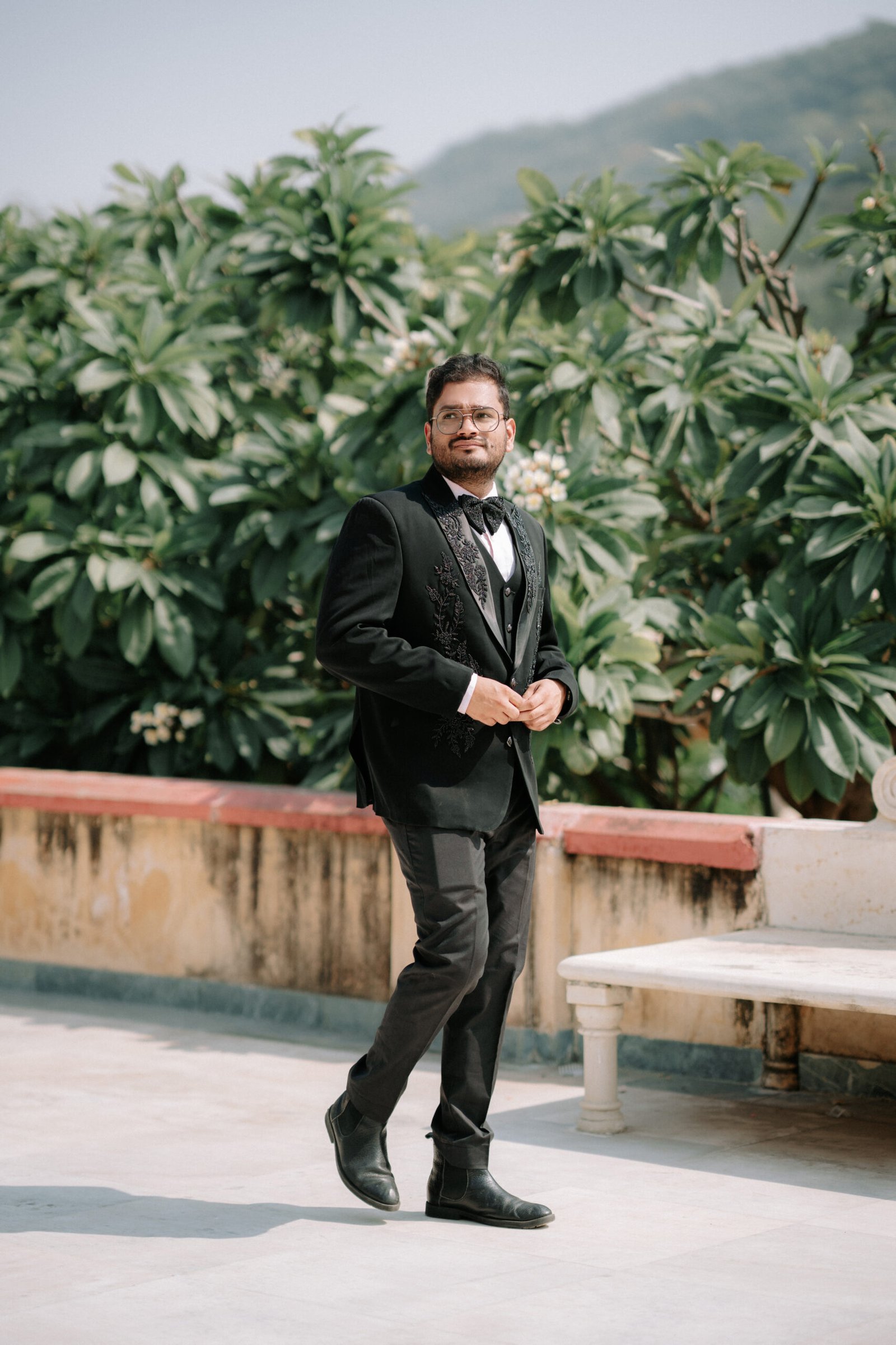 The groom sharing joyful moments with family, captured in authentic wedding photographs by Mohey Rang Films.