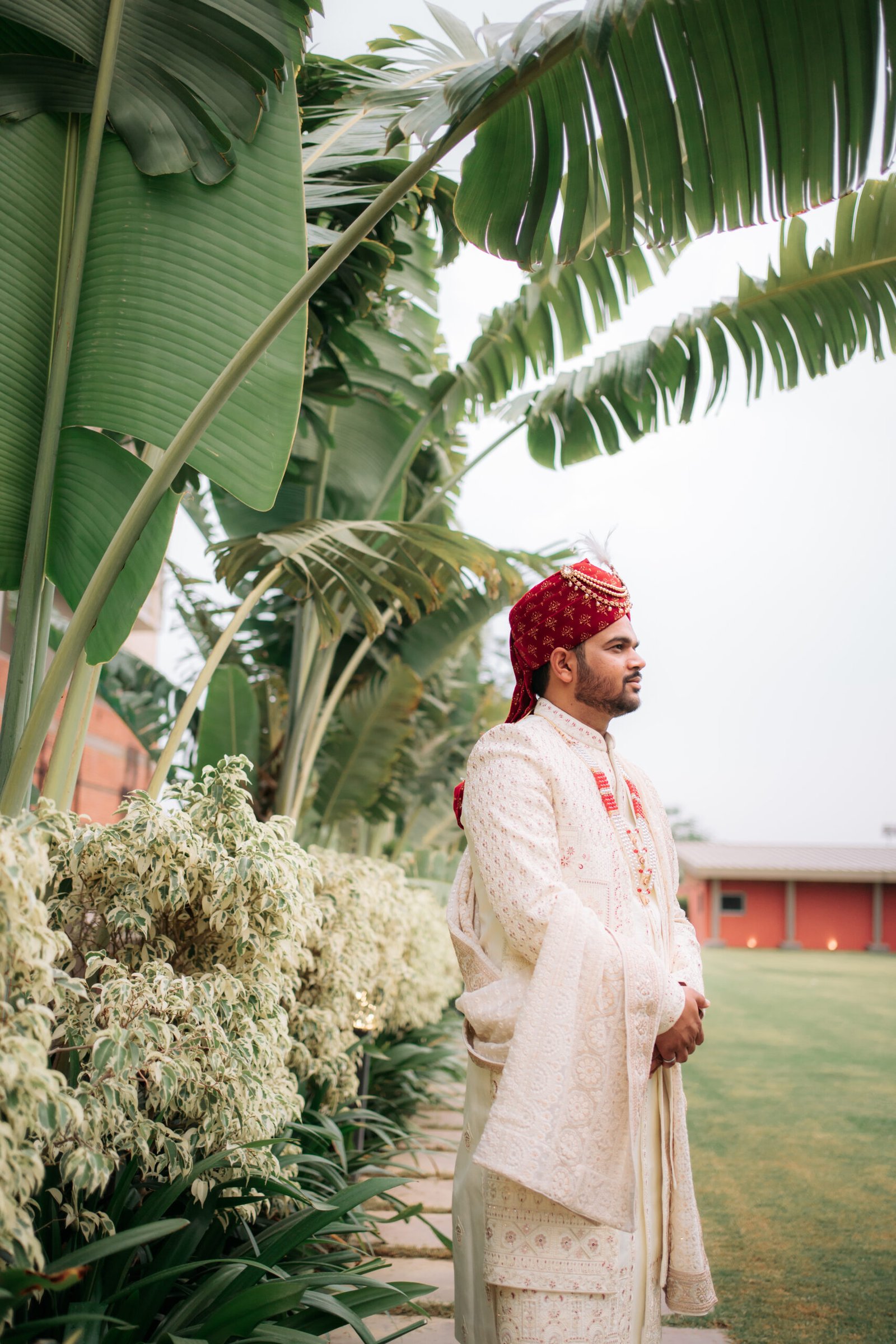 A candid moment of the groom smiling during the wedding day, captured as professional wedding photographs by Mohey Rang Films.