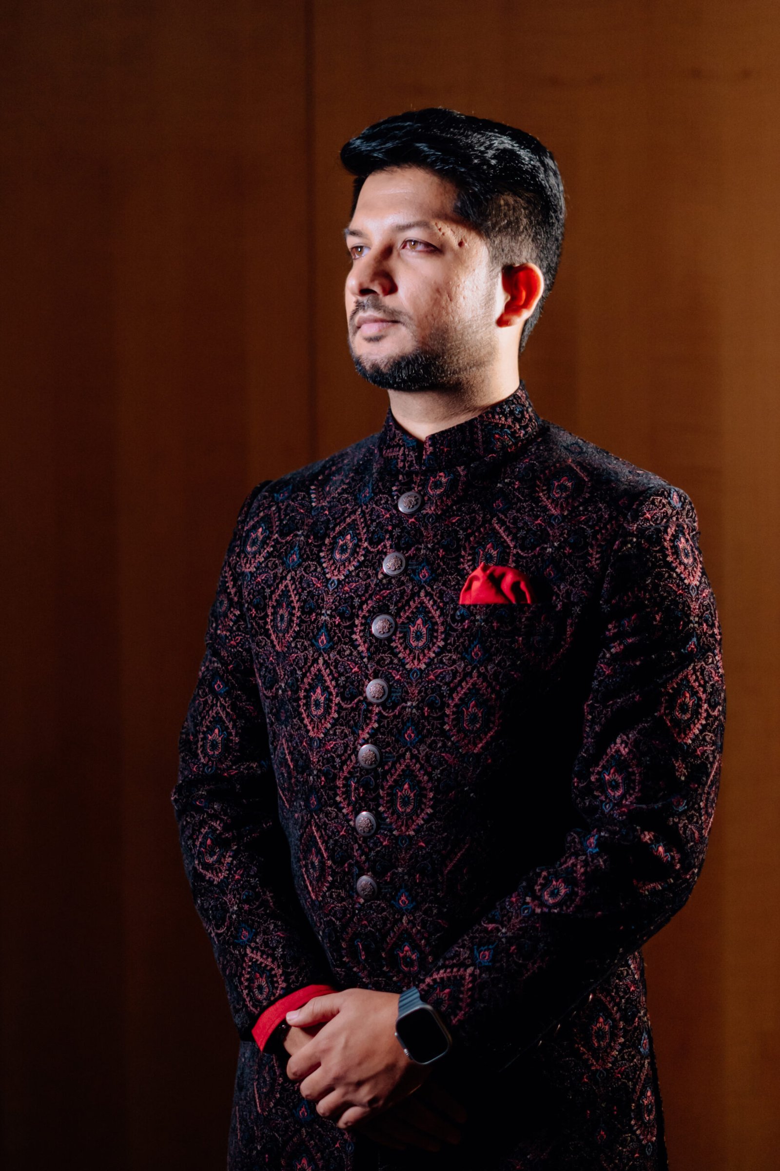 The groom posing outdoors in natural light, captured by Mohey Rang Films as stunning wedding photographs.