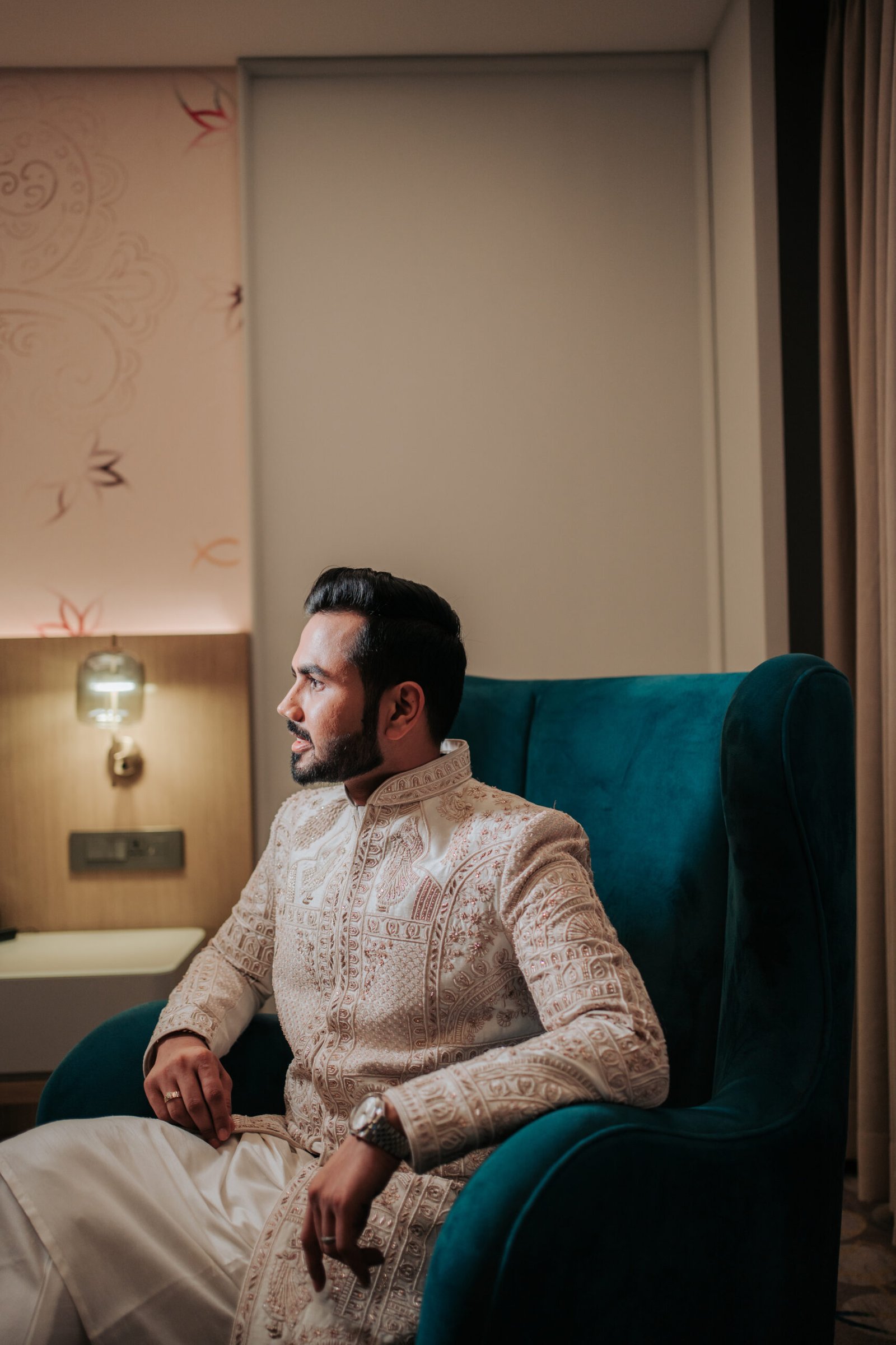 The groom getting ready for his wedding, captured as detailed and stylish wedding photographs by Mohey Rang Films.