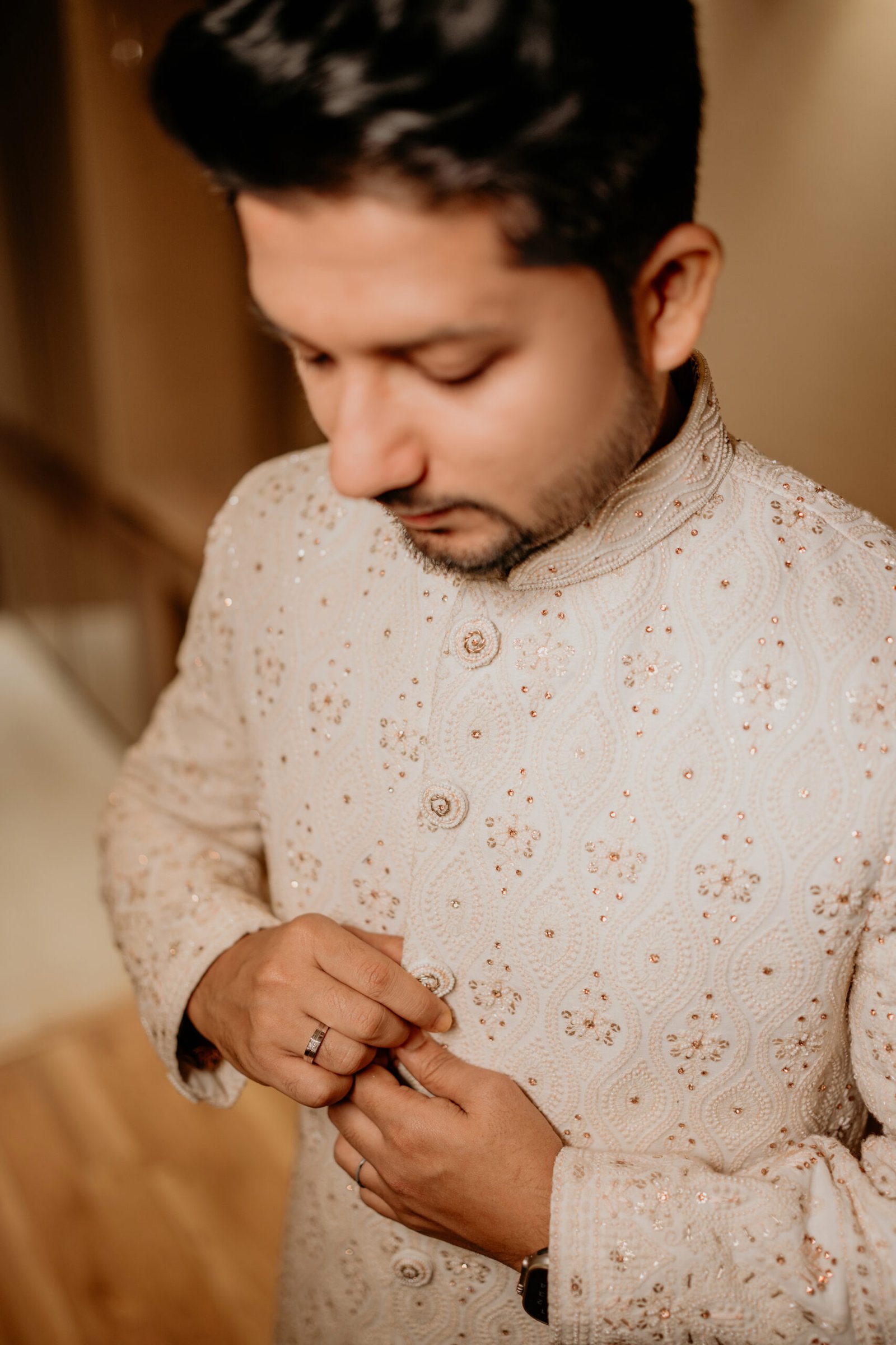 A sophisticated groom portrait captured by Mohey Rang Films, showcasing professional wedding photographs with style and elegance.